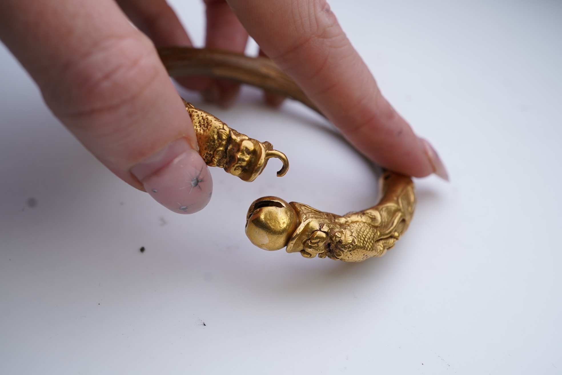 A gold and wood bangle, China, late 19th/early 20th century